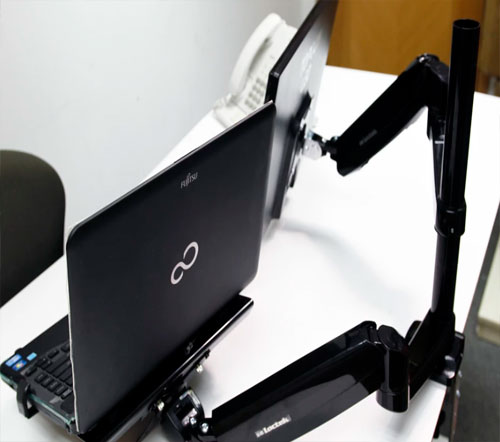 Soporte de brazo retractil para monitor y portatil